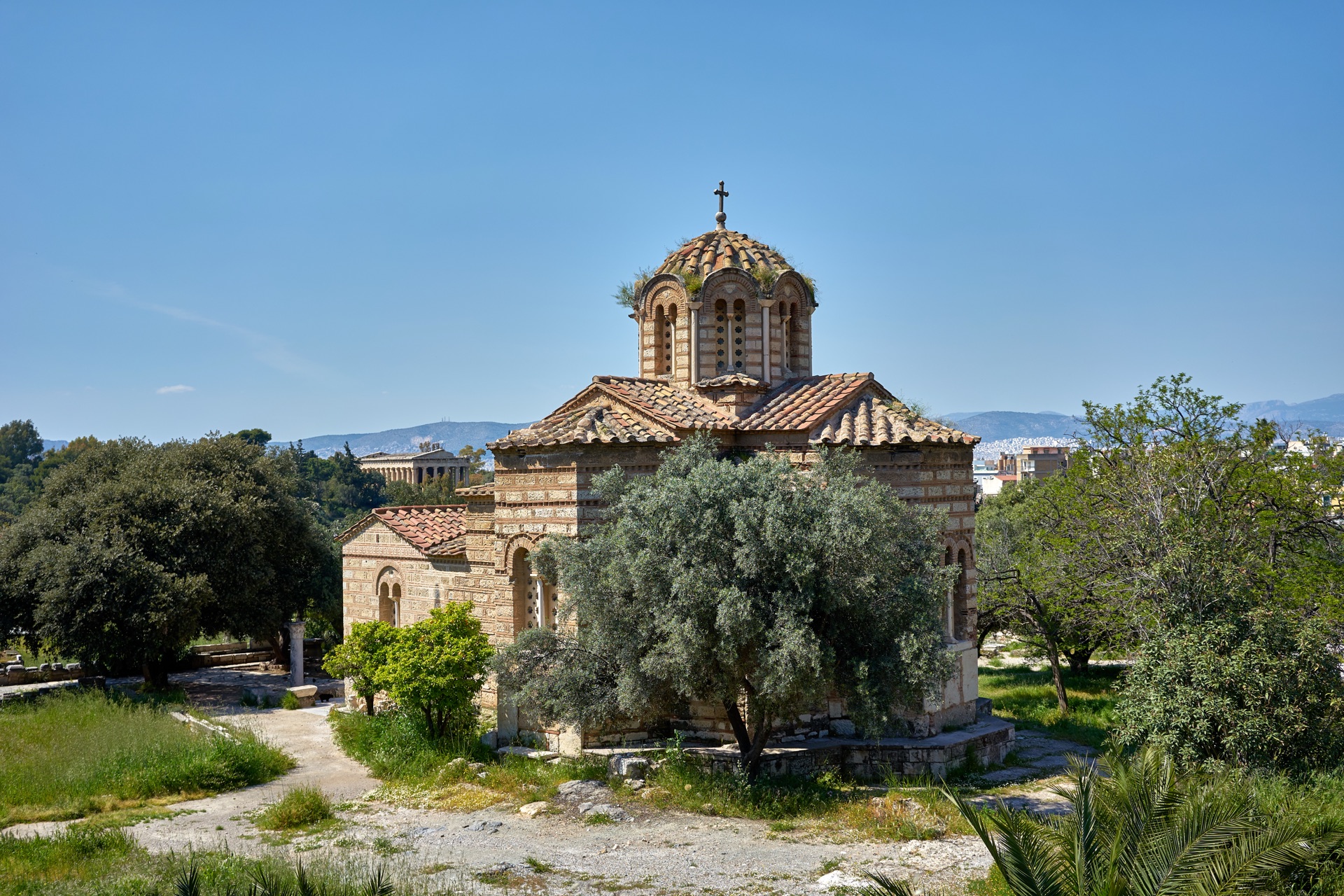The Byzantine Church of the Holy Apostles in the Ancient Agora of Athens, ringed by the archaeological site with the modern city beyond.